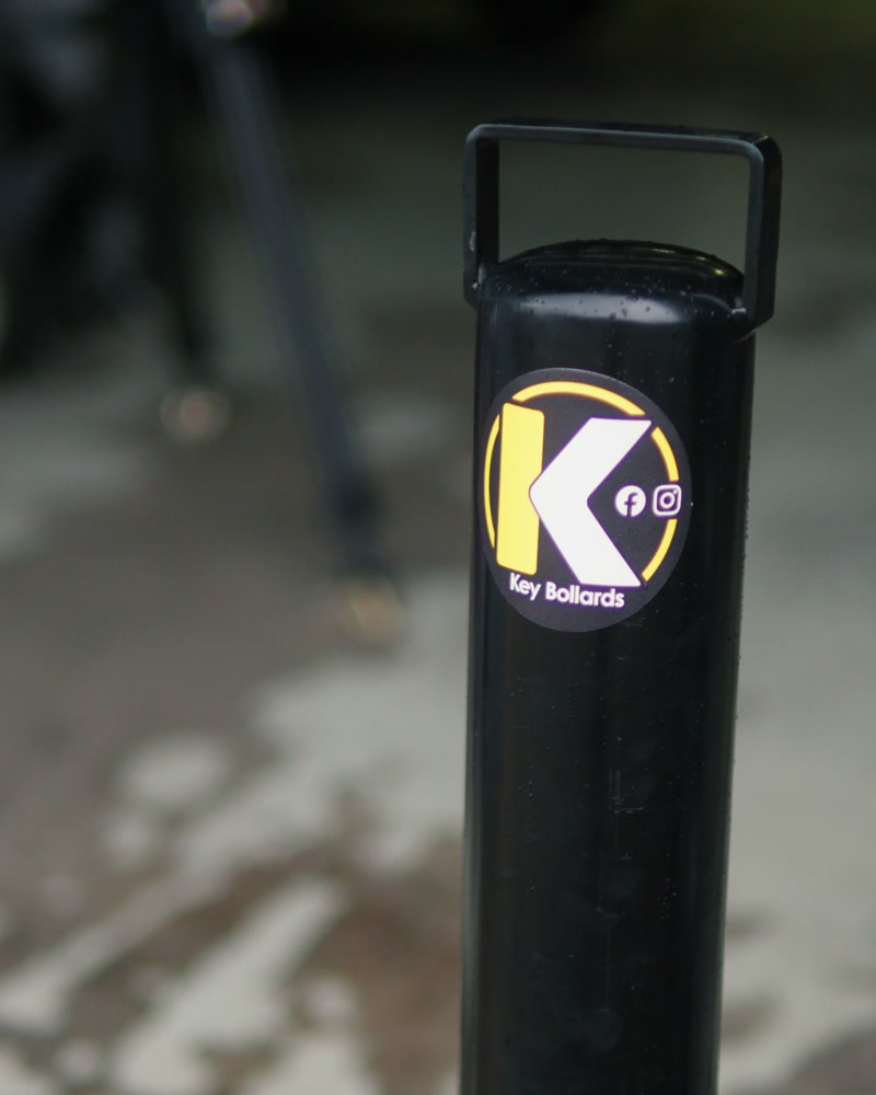 Key Bollards removable security bollard installed in a Melbourne driveway, lift handle up and the K badge on the post